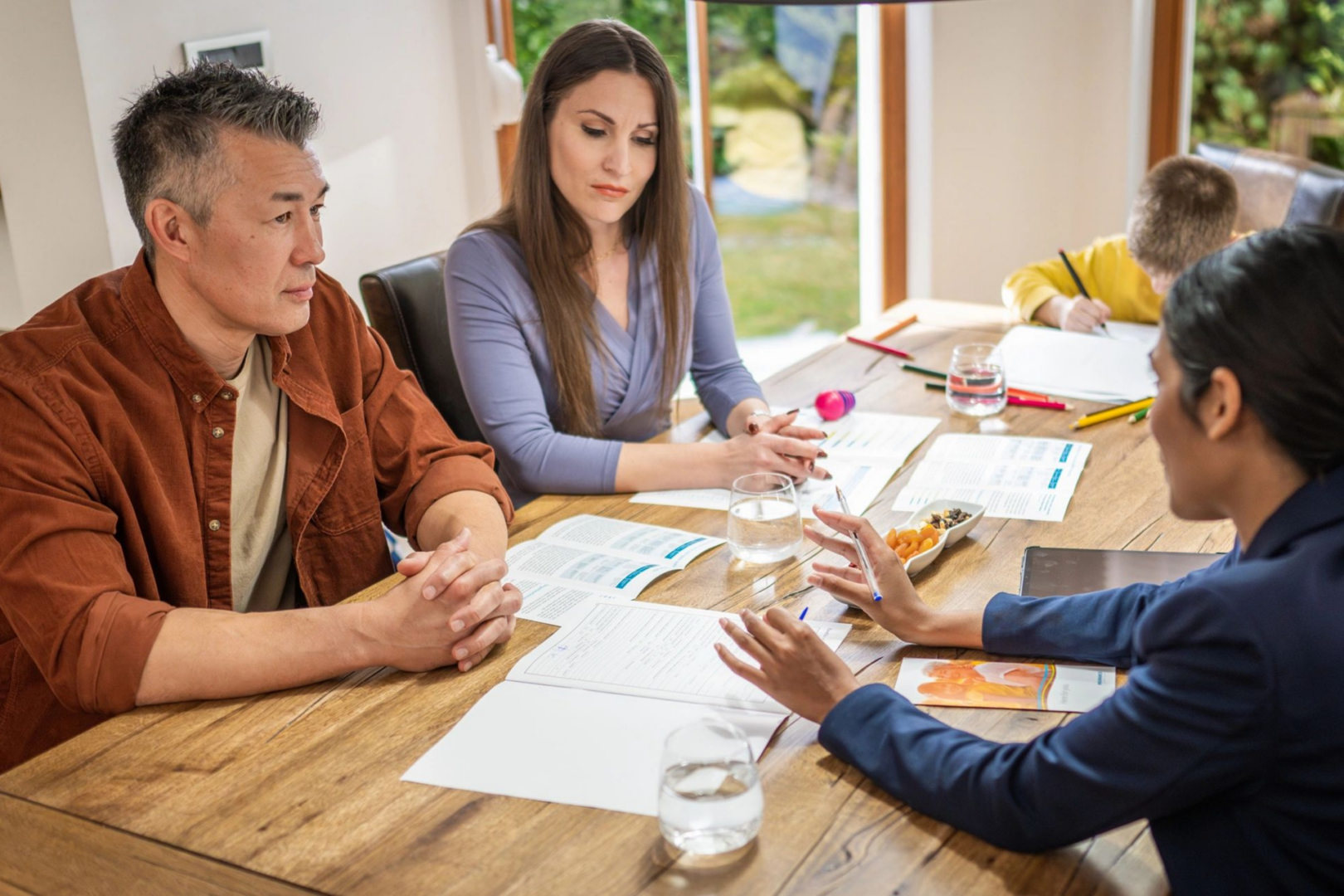 Family discussing finances with a consultant