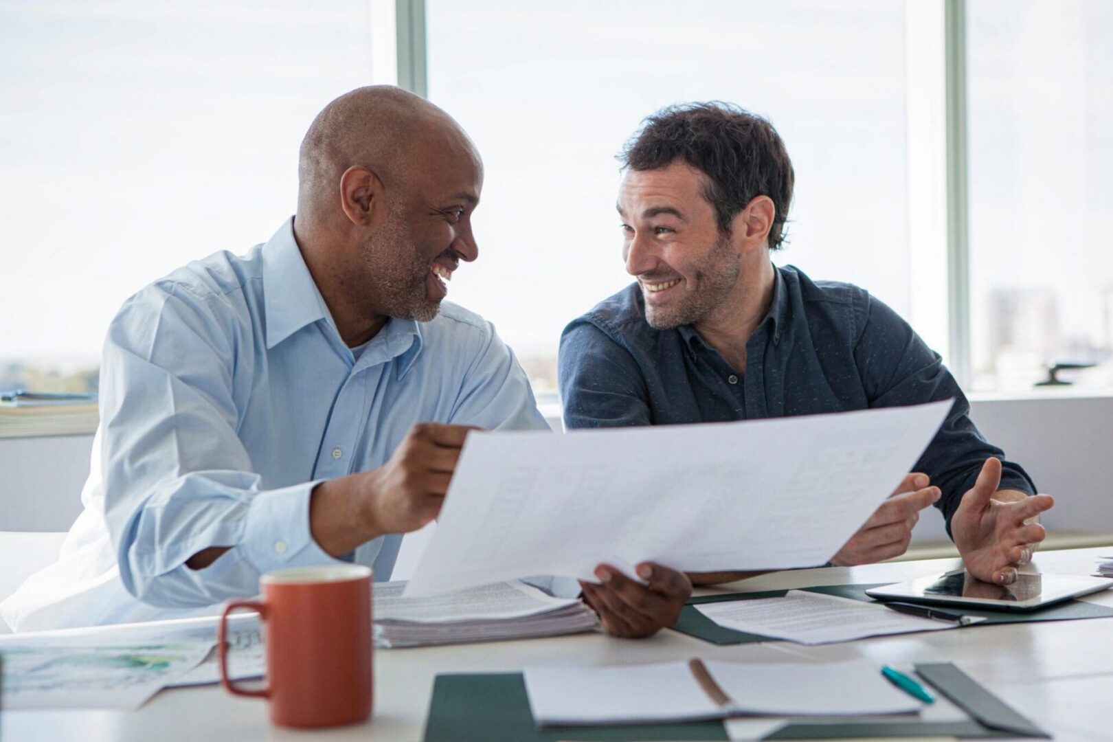 Professionals collaborating on office work