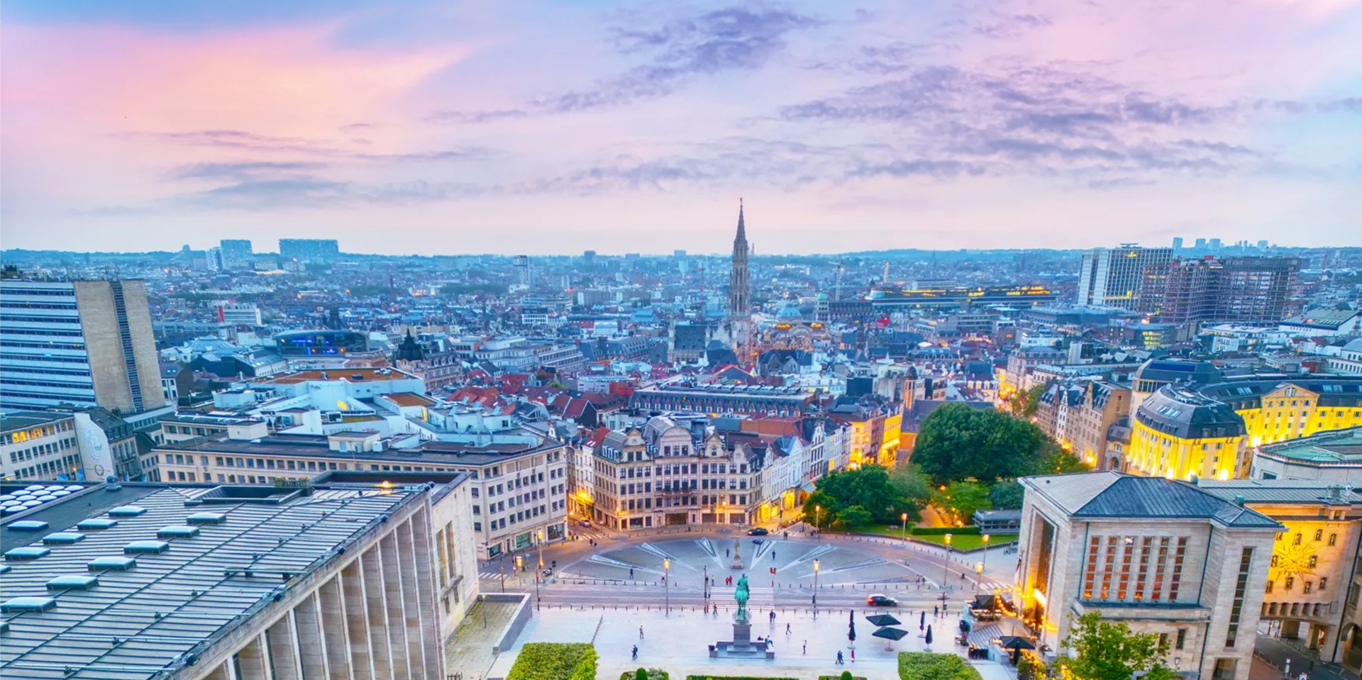 Illuminated city buildings and twilight sky