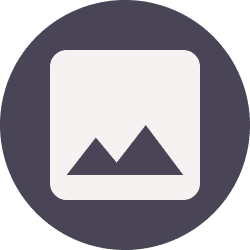 Mountain icon on circular dark background.